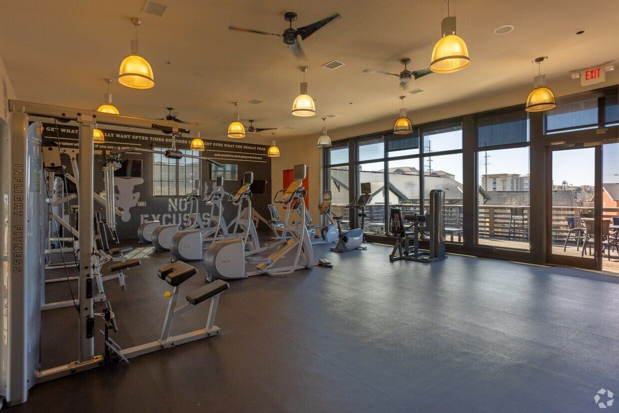 Fitness center cardio room with floor-to-ceiling windows