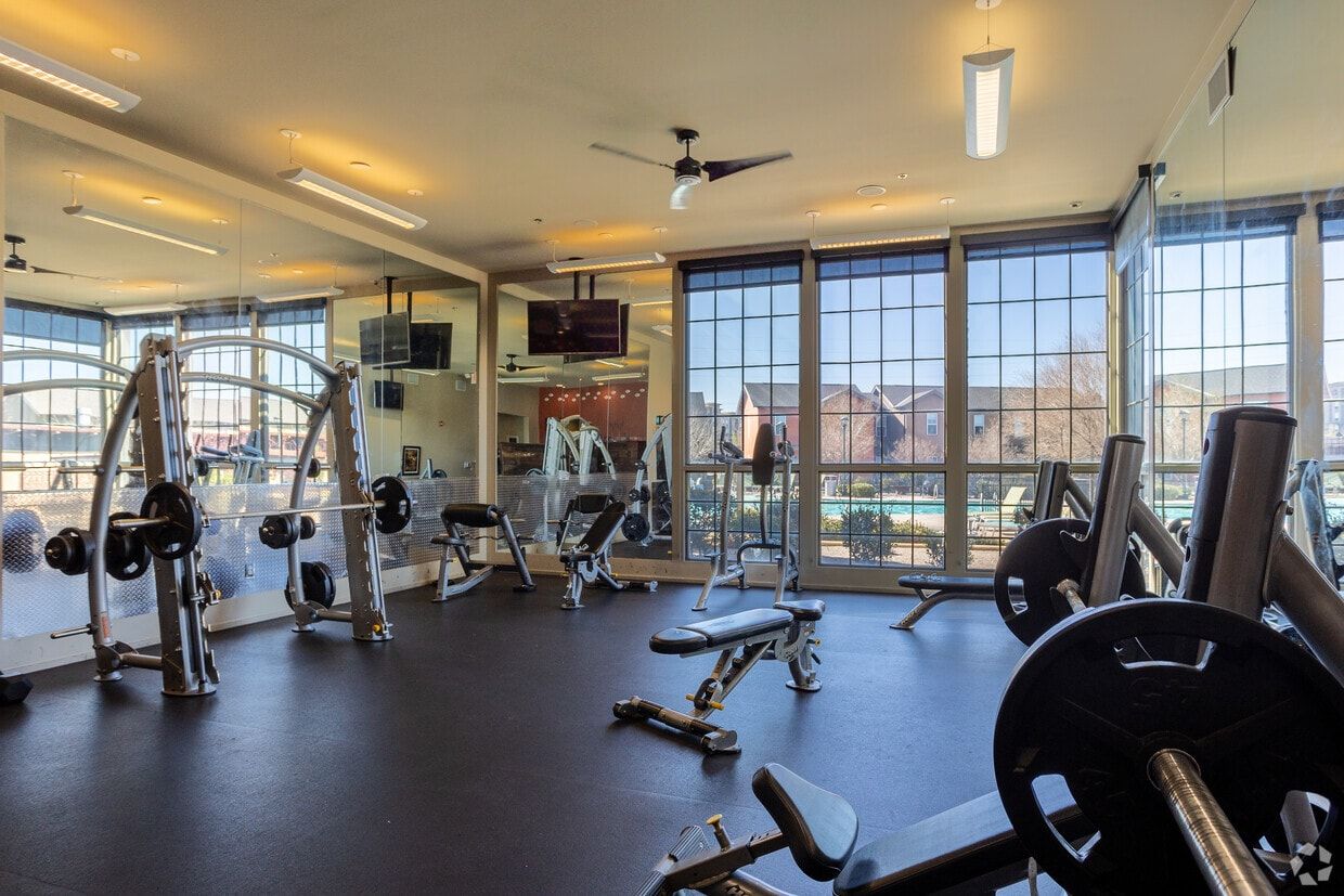 Weight room with free weights and a Smith machine